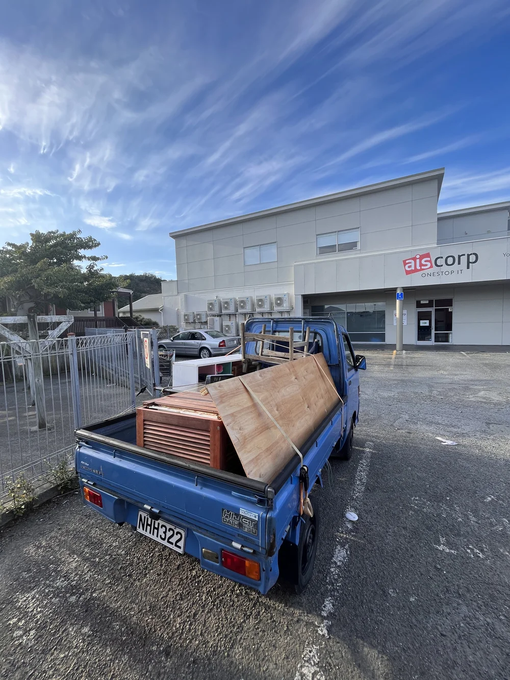 The Tiny Truck loaded with office furniture and fit-out outside a commercial building
